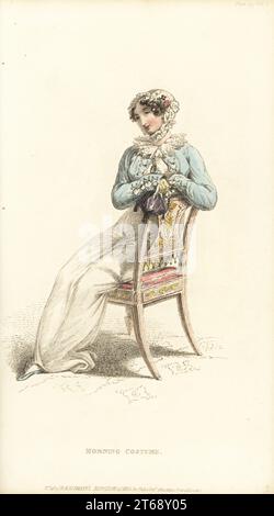 Regency woman in autumnal carriage dress. Jaconot muslin robe with double frills of Vandyke lace. Grey satin spencer with buttons en militaire. Foundling cap of lace, lemon gloves, purple velvet ridicule. Plate 27, Vol. 8, October 1 1812. Handcoloured copperplate engraving by Thomas Uwins from Rudolph Ackermann's Repository of Arts, London. Stock Photo