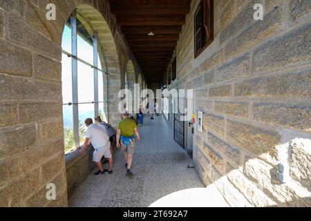 Berchtesgaden, Germany, EU - Aug.1, 2023. Hitler's Eagle's Nest, Kehlsteinhaus interior with tourists reading displays, World War II museum exhibit Stock Photo
