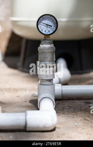 Water pressure meter pipe connection in house plumbing Stock Photo