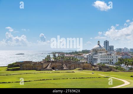 Puerto Rico Capitol Building beyond  the lawn of the Castillo San Cristobal fort in San Juan, Puerto Rico Stock Photo