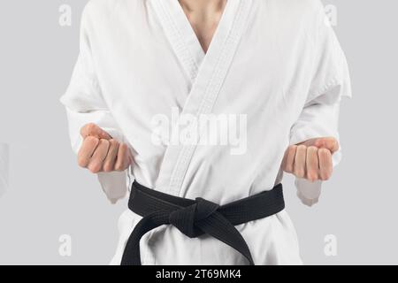 Black belt teenage boy with both hands in chamber Stock Photo