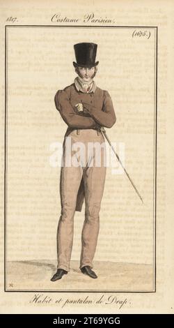 French gentleman in top hat, wool coat and trousers, holding a cane. Habit et pantalon du Drap. Handcoloured copperplate engraving by Pierre-Charles Baquoy after a fashion plate by Horace Vernet from Pierre de la Mesangeres Journal des Dames et des Modes, Magazine of Women and Fashion, Paris, 1817. Stock Photo