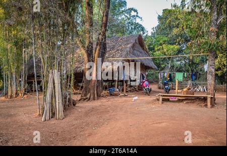 Scootors outside a hut in the Lu Mien-Yao tribe area of the Union of Hill Tribe Villages outside of Chiang Rai in the Nanglae District of Thailand Stock Photo