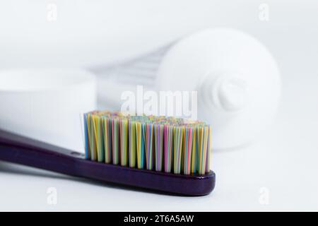 Tube toothpaste and tooth brush closeup, selective focus. Daily dental care concept. Stock Photo