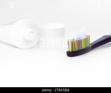 Toothbrush with white toothpaste on white background. Stock Photo