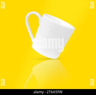 White coffee cup on yellow background, soft focus. Stock Photo