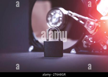 Saving user data. Hacking a password on a PC. Closing access to files. Hackers and secret data. HDD and key with lock.. Stock Photo