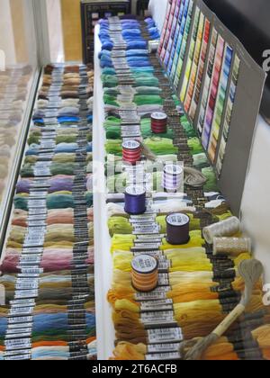 Paisley Thread Mill Museum celebrates the industrial heritage of making reels of stranded cotton & embroidery threads in a rainbow of colours. Stock Photo