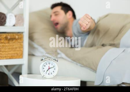 man having trouble waking up in morning Stock Photo