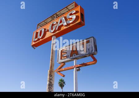 Abandoned gas station and restaurant signs shown along the I-15 in California. Stock Photo