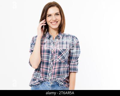 Happy beautiful lady on mobile phone isolated, on white background, copy space, brunette Woman with a cell phone. Isolated on white background. Stock Photo