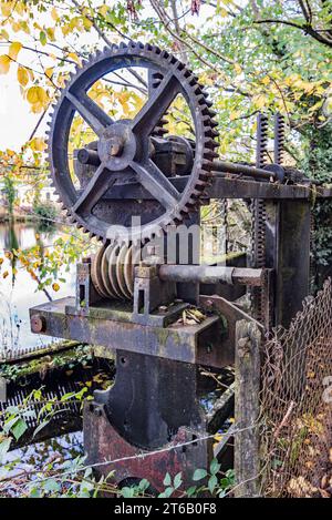Gear mechanism at the mill pond above High Mill in Langcliffe North Yorkshire ....... the site of a former water-powered corn-mill and cotton-mill. Stock Photo