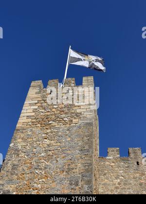 The Flag of Lisbon, or the Flag of Saint Vincent, on the Saint George's Castle (Castelo de São Jorge) in Lisbon Stock Photo