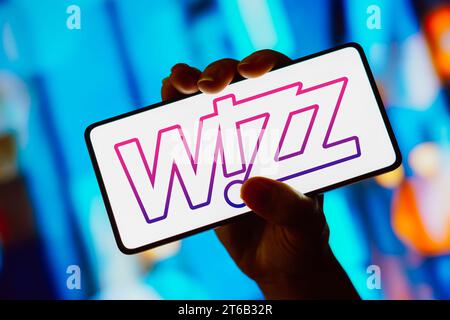 In this photo illustration, the Wizz Air logo is displayed on a smartphone screen. Stock Photo