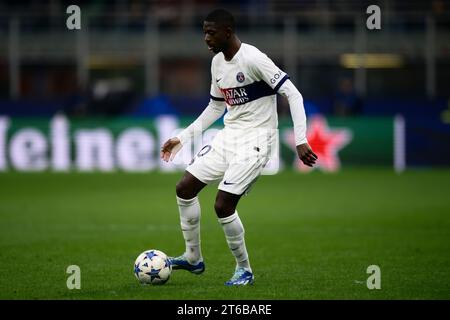 Ousmane Dembele of Paris Saint Germain (R) runs with the ball during ...