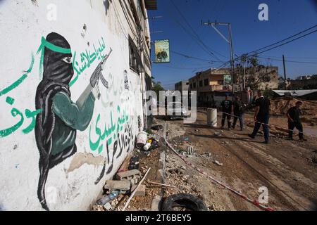 Tulkarm, Palestine. 08th Nov, 2023. Palestinians walk through a destroyed street after an Israeli military raid in Tulakrem refugee camp in the West Bank. (Photo by Nasser Ishtayeh/SOPA Images/Sipa USA) Credit: Sipa USA/Alamy Live News Stock Photo