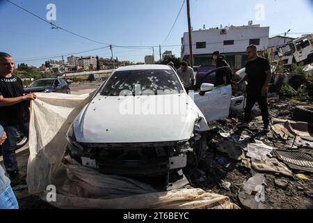 Tulkarm, Palestine. 08th Nov, 2023. People look at the car in which Israeli forces killed four Palestinian militants the day before in Tulkarem, West Bank. (Photo by Nasser Ishtayeh/SOPA Images/Sipa USA) Credit: Sipa USA/Alamy Live News Stock Photo