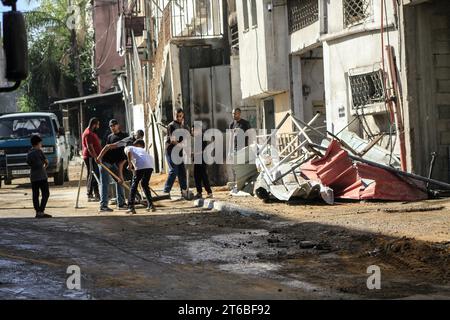 Tulkarm, Palestine. 08th Nov, 2023. Palestinians walk through a destroyed street after an Israeli military raid in Tulakrem refugee camp in the West Bank. (Photo by Nasser Ishtayeh/SOPA Images/Sipa USA) Credit: Sipa USA/Alamy Live News Stock Photo