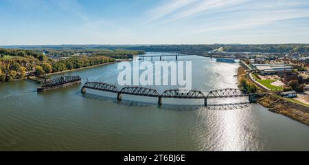 Aerial view of historic Dubuque railroad bridge between Iowa and Illinois across the Mississippi river with cruise boat in distance Stock Photo