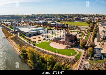 Dubuque, IA - 17 October 2023: Aerial view of historic Dubuque Star Brewery and modern convention center alongside Mississippi river in Iowa Stock Photo