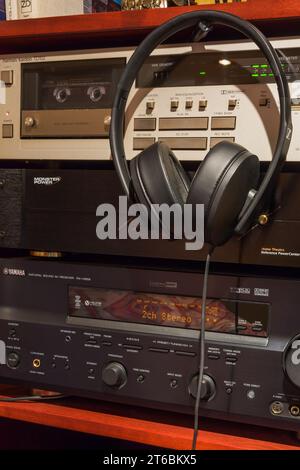 Sennheiser HD 300 stereo headphones with Harmon Kardon TD102 Cassette Deck, Monster Power Center HTS 2500, Yamaha Natural Sound AV Reciever RX-V659. Stock Photo