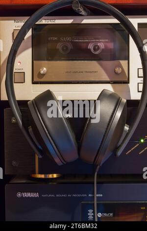 Sennheiser HD 300 stereo headphones with Harmon Kardon TD102 Cassette Deck, Monster Power Center HTS 2500, Yamaha Natural Sound AV Reciever RX-V659. Stock Photo