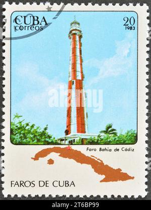 Cancelled postage stamp printed by Cuba, that shows Cadiz Bay lighthouse, circa 1983. Stock Photo