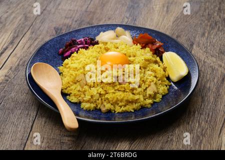 Japanese dry curry is curry rice that uses curry powder without gravy. It is rice cooked in soup with chicken and vegetables, then curry spices added Stock Photo