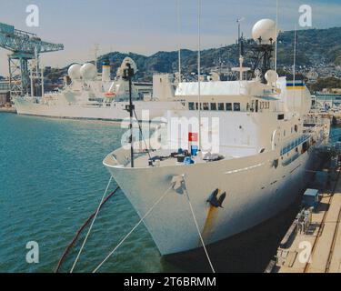 USNS Observation Island (T-AGM-23) and USNS Invincible (T-AGM-24) at Sasebo, Japan Stock Photo