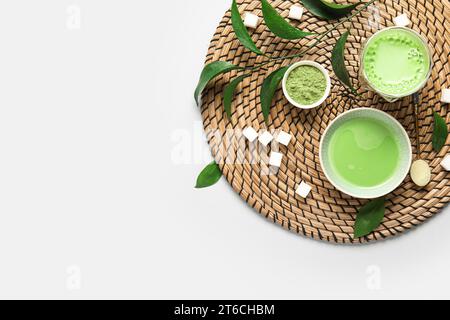 Composition with fresh matcha tea, powder and sugar on grey background Stock Photo