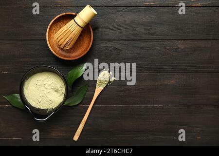 Composition with powdered matcha tea and accessories on dark wooden background Stock Photo