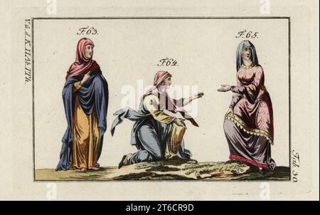 Anglo Saxon women's costumes. Woman in mantle 63, woman in mantle wearing her veil in a particular manner 64, and woman in a tunic with borders of various colours and a robe with large wide sleeves 65. Handcolored copperplate engraving from Robert von Spalart's Historical Picture of the Costumes of the Principal People of Antiquity and Middle Ages, Vienna, 1796. Stock Photo