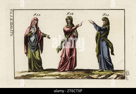 Anglo Saxon womens dress. One wearing tunic, mantle and veil 33, one in a floating veil 34, and one with tunic, belt and veil 35. Handcolored copperplate engraving from Robert von Spalart's Historical Picture of the Costumes of the Principal People of Antiquity and Middle Ages, Vienna, 1796. Stock Photo