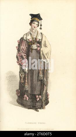 Regency woman in carriage dress and Polish cap. Dress of jaconot muslin with lace frill and pink ribbons, French shawl, black velvet Polish cap with silk tassel and gold band, French watch, gold rosary. Designed by Mrs Elizabeth Gill of Cork Street; Burlington Gardens. Series 2, Vol. 1, Plate 17, March 1, 1816. Handcoloured copperplate engraving by Thomas Uwins from Rudolph Ackermann's Repository of Arts, Strand, London. Stock Photo