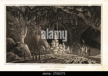 Tourists with torches exploring the grotto of Antiparos, Aegean Sea, Greece.. Cave with stalactites and stalagmites. Aquatint drawn and engraved by William Daniell from William Woods Zoography, Cadell and Davies, 1807. Stock Photo