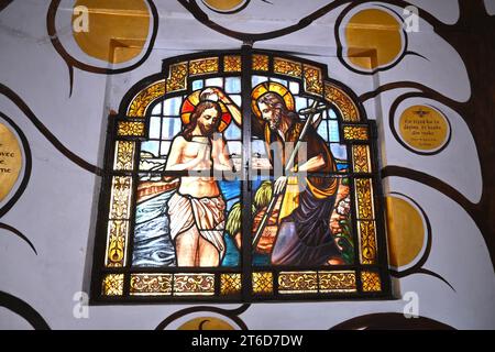 Stained glass window inside the Chapel of the Golden Rule in the Church of St. John the Baptist at the Béguinage – Brussels Belgium – 24 October 2023 Stock Photo