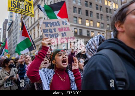 NEW YORK, NEW YORK - NOVEMBER 9: A protester holds a sign while marching through Midtown Manhattan during a student walkout calling for a ceasefire between Israel and Hamas on November 9, 2023 in New York City. Since October 7, the Israeli army's bombardment of the Palestinian enclave, in retaliation for the Hamas attack on Israel that killed over 1,400 people, has seen thousands of buildings razed to the ground, more than 10,000 people killed and 1.4 million displaced whilst Gaza remains besieged. (Photo by Michael Nigro/Sipa USA) Credit: Sipa USA/Alamy Live News Stock Photo