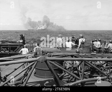 USS Intrepid (CV-11) burning after kamikaze hits, 25 November 1944 (520885) Stock Photo