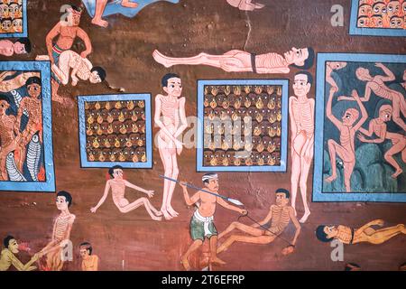 A mural in a temple, depicting torture, fire, hellish things. At Wat Saket, The Golden Mount. In Bangkok, Thailand. Stock Photo