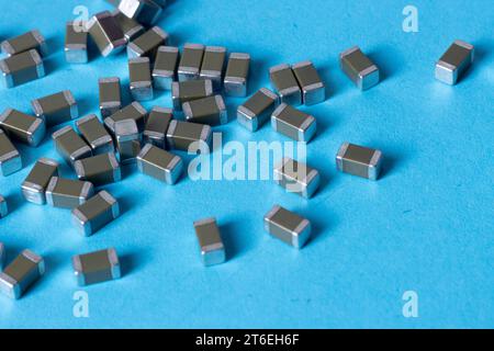 smd ceramic capacitors, on a blue table, electronic component Stock Photo