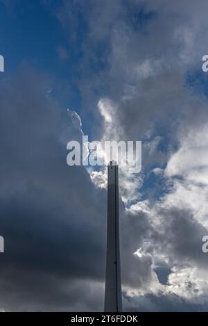 Cloudy sky with chimney of the thermal power station, Erlangen, Middle Franconia, Bavaria, Germany Stock Photo