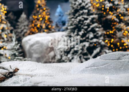 Christmas blurred background. Xmas trees with bokeh. Forest trees covered by snow. Cozy Christmas atmosphere. Copy space. Happy New Year 2024 Stock Photo