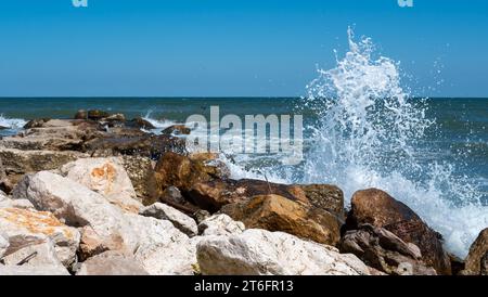 rocks on the beach with waves Stock Photo