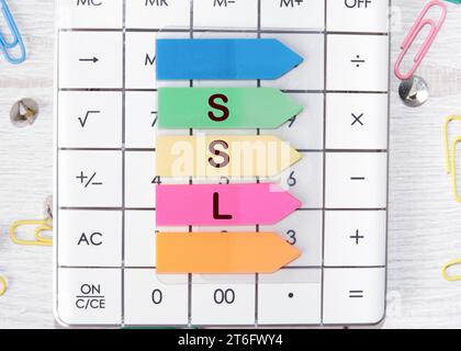 SSL word is laid out of stickers with up arrows on the calculator Stock Photo