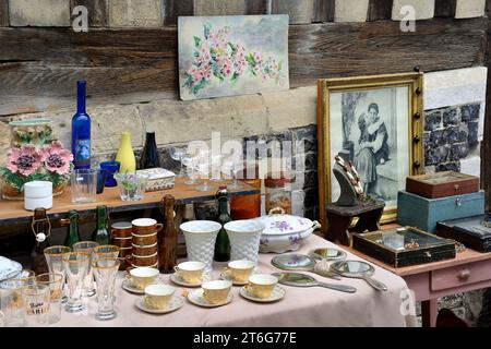 Second-hand collectable items displayed at a Flea Market, Brocante, Place Sainte Catherine, Honfleur, Normandy, France Stock Photo