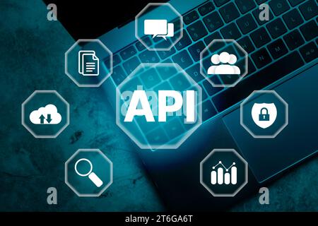 Top viw photo of laptop with API word on VR screen and multimedia icons. Internet and technology concept. Business, programming, interface. Stock Photo