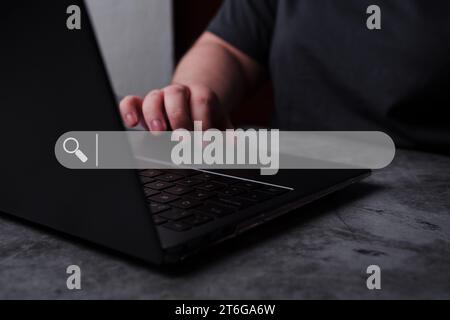 Woman using laptop with VR search bar interface. SEO Search Engine Optimization concept. Ranking traffic on website. Browser concept. Stock Photo