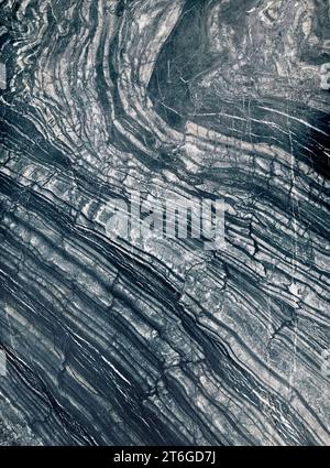 The white natural lines on black or beautiful black marble's texture, close up on the surface, vertical image. Stock Photo