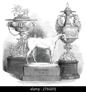 The Goodwood Race Plate, 1860. 'The Stewards' Cup, by Messrs. London and Ryder, is of charming design and workmanship. The general form of the vase resembles the proportions of some antique models and the sculptural decorations are appropriately chosen from classic mythological fable. The group on the cover represents Bellerophon, mounted on Pegasus, the winged horse of the Muses, conquering the Chimaera...The shaft is decorated with the head of Medusa, winged monsters, and boys...Mr. T. W. Reeve was the designer and modeller of this cup. The Goodwood Cup, by R. and S. Garrard and Co., is a fi Stock Photo