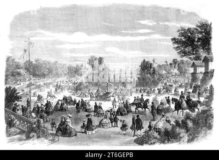 A scene in the Bois de Boulogne - the Pr&#xe9; Catelan, 1860. In this wood of woods, whose clear and beautiful lakes, fairylike islands, pretty chalets, and charming promenades for visitors, either on foot, en voiture, or on horseback, offer a succession of enjoyments, there exists also the fashionable resort represented in our Illustration, open in the daytime for a small entrance-fee, and at night, in the fine summer season, for concerts and theatrical performances in the open air...[It is] attended by an immense number of wealthy Parisians and distinguished foreigners. Our Engraving...depic Stock Photo